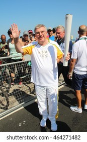 RIO DE JANEIRO, AUGUST 5, 2016: Olympic Torch Arrives In Ipanema Beach For The Olympic Games. Thomas Bach, President Of The International Olympic Committee