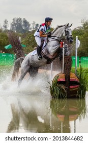 RIO DE JANEIRO - AUGUST 8, 2016: Great Britain's Gemma Tattersall Begins Her Jump Over An Obstacle In The Water Complex During The Cross Country Equestrian Riding Event In The 2016 Summer Olympics.