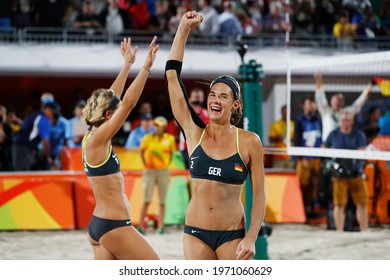 Rio de Janeiro, Brazil 08.17.2016: Laura Ludwig and Kira Walkenhorst of Germany beach volleyball team score gold medal final match at Rio 2016 Olympic Games. German players win over brazilian team.