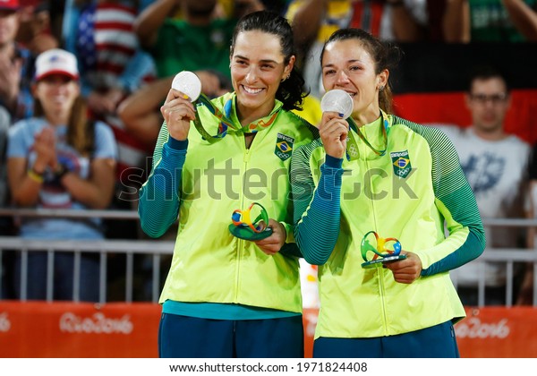 Rio de\
Janeiro, Brazil 08.17.2016: Ágatha Bednarczuk and Bárbara Seixas,\
brazilian beach volleyball silver medalist team celebrates at Rio\
2016 Olympic Games podium medal ceremony.\
