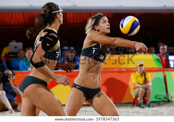 Rio de Janeiro, Brazil 08.17.2016: Laura Ludwig and\
Kira Walkenhorst of Germany beach volleyball team score gold medal\
final match at Rio 2016 Olympic Games. German players win over\
brazilian team.