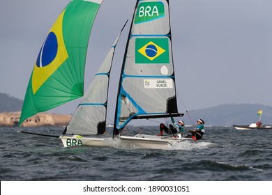 Rio De Janeiro Brazil 08.18.2016: Sailing At Rio 2016 Olympic Games. Brazilian Sailors Martine Grael And Kahena Kunze Win Gold Medal 49er FX Class. Women Skiff Sail Boat Medalists At Guanabara Bay.