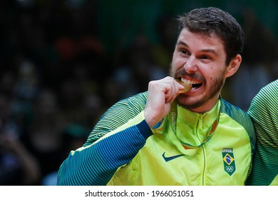 Rio De Janeiro, Brazil 08.21.2016: Brazilian National Volleyball Team Celebrating Gold Medal At Rio 2016 Olympic Games, Maracanazinho Stadium. Bruno Rezende, Bruninho, Player At Podium Ceremony 