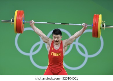 Rio De Janeiro, Brazil, 19 August 2016: China Gold Medal Weightlifter, Shi Zhiyoung, lifting in the clean and jerk category when playing at Riocentro Pavilion 2, at the Olympic Games Rio 2016, Brazil.