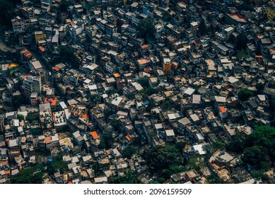 RIO DE JANEIRO, BRAZIL - AUGUST 11 : Favela slum located within downtown seen from aerial Mountain view in Rio de Janeiro, Brazil on August 11, 2016.