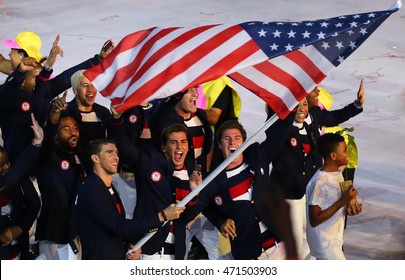 RIO DE JANEIRO, BRAZIL - AUGUST 5, 2016: Olympic champion Michael Phelps carrying the United States flag leading the Olympic team USA in the Rio 2016 Opening Ceremony at Maracana Stadium 