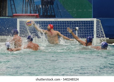 RIO DE JANEIRO, BRAZIL - AUGUST 10, 2016: Water Polo Team Greece (in White) Scores During Rio 2016 Olympics Men's Preliminary Round Group A Match Against Team Hungary At The Maria Lenk Aquatic Center 