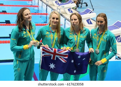 RIO DE JANEIRO, BRAZIL - AUGUST 13, 2016: Silver Medalists Team Australia Women's 4 × 100m Medley Relay Emily Seebohm (L),  Taylor McKeown, Emma McKeon And Cate Campbell At The Rio 2016 Olympics