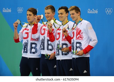 RIO DE JANEIRO, BRAZIL - AUGUST 13, 2016: Great Britain Men's 4x100m Medley Relay Team Chris Walker-Hebborn, Adam Peaty, James Guy, Duncan Scott During Medal Ceremony At The Rio 2016 Olympic Games 