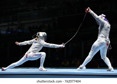 RIO DE JANEIRO, BRAZIL - AUGUST 13, 2016: Dagmara Wozniak Of United States (R) And Ekaterina Dyachenko Of Russia Compete In The Women's Sabre Team Of The Rio 2016 Olympic Games At Carioca Arena 3