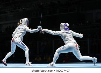 RIO DE JANEIRO, BRAZIL - AUGUST 13, 2016: Dagmara Wozniak Of United States (R) And Ekaterina Dyachenko Of Russia Compete In The Women's Sabre Team Of The Rio 2016 Olympic Games At Carioca Arena 3