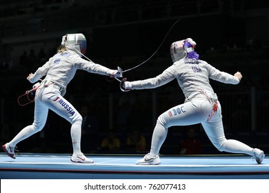 RIO DE JANEIRO, BRAZIL - AUGUST 13, 2016: Dagmara Wozniak Of United States (R) And Ekaterina Dyachenko Of Russia Compete In The Women's Sabre Team Of The Rio 2016 Olympic Games At Carioca Arena 3