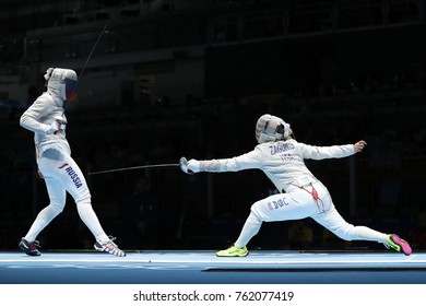 RIO DE JANEIRO, BRAZIL - AUGUST 13, 2016: Dagmara Wozniak Of United States (R) And Ekaterina Dyachenko Of Russia Compete In The Women's Sabre Team Of The Rio 2016 Olympic Games At Carioca Arena 3