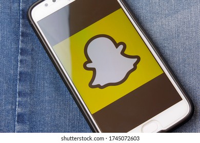 Rio de Janeiro, Brazil - February 14, 2020: Logo Snapchat on the Moto G5s Plus smartphone screen, in the pocket of jeans. It is an image based messaging application
