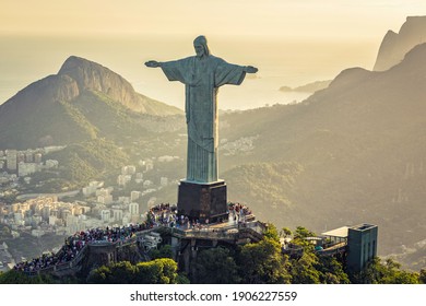 RIO DE JANEIRO, BRAZIL - FEBRUARY 2016:  Aerial view of Christ and Sugar Loaf Mountain, Rio De Janeiro, Brazil . People on the top of Corcovado Hill