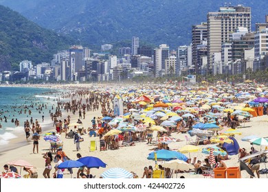 Rio de Janeiro, Brazil - February 5: Tourists and locals enjoying the summer at the famous Ipanema beach in Rio de Janeiro, Brazil.