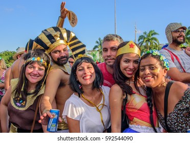 RIO DE JANEIRO, BRAZIL - FEBRUARY 28, 2017: Happy People In Costumes Of Egypt Pharaoh, Cleopatra, Wonder Woman And Frida Kahlo With Unibrow At Bloco Orquestra Voadora In Flamengo Park, Carnaval 2017