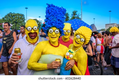 RIO DE JANEIRO, BRAZIL - FEBRUARY 28, 2017: Costumed family of the Simpsons with Homer, Marge, Bart, Lisa and Maggie at Bloco Orquestra Voadora in Flamengo Park, Carnaval 2017