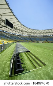 RIO DE JANEIRO, BRAZIL - JANUARY 29, 2014: Pitch-level View Of Maracana Football Soccer Stadium Grandstand With Technical Area Dugout And Bench.