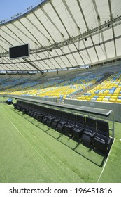 RIO DE JANEIRO, BRAZIL - JANUARY 29, 2014: Maracana Football Soccer Stadium Grandstand With Technical Area Dugout And Bench.