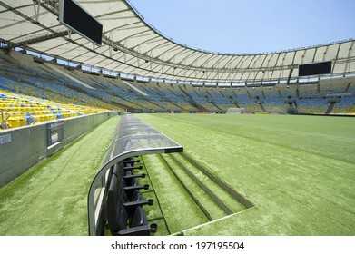 RIO DE JANEIRO, BRAZIL - JANUARY 29, 2014: Pitch-level View Of Maracana Football Soccer Stadium Grandstand With Technical Area Dugout And Bench.