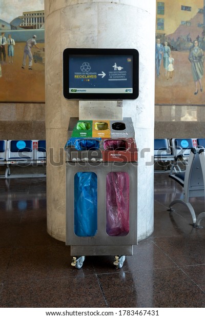 Rio de Janeiro, Brazil - July 11, 2020: Column at\
the Santos Dumont national airport with divided trash bins for\
reuse, reduce or recycle purposes part of the sustainable\
development goals
