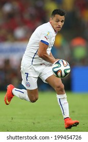 RIO DE JANEIRO, BRAZIL - June 18, 2014: Alexis Sanchez competes for a ball during the 2014 World Cup Group B game between Spain and Chile at Maracana Stadium. NO USE IN BRAZIL.