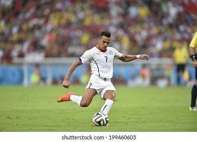 RIO DE JANEIRO, BRAZIL - June 18, 2014: Alexis SANCHEZ of Chile kicks the ball during the 2014 World Cup Group B game between Spain and Chile at Maracana Stadium. 
