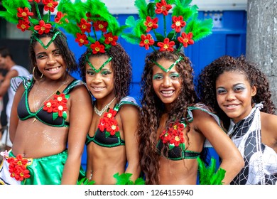 Rio de Janeiro, Brazil - March 3, 2014: Young girls in matching festive costumes at a carnival block party in the city centre of Rio de Janeiro - Shutterstock ID 1264155940