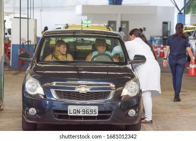 RIO DE JANEIRO, BRAZIL, MARCH, 23, 2020:flu Vaccination In Elderly People Using The Drive Thru System Receive The Vaccine Inside The Car To Prevent Crowding Due To The Coronavirus, Covid19