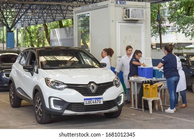 RIO DE JANEIRO, BRAZIL, MARCH, 23, 2020:flu Vaccination In Elderly People Using The Drive Thru System Receive The Vaccine Inside The Car To Prevent Crowding Due To The Coronavirus, Covid19