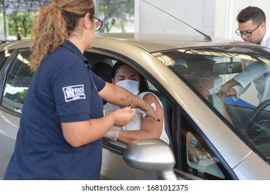 RIO DE JANEIRO, BRAZIL, MARCH, 23, 2020:flu Vaccination In Elderly People Using The Drive Thru System Receive The Vaccine Inside The Car To Prevent Crowding Due To The Coronavirus, Covid19