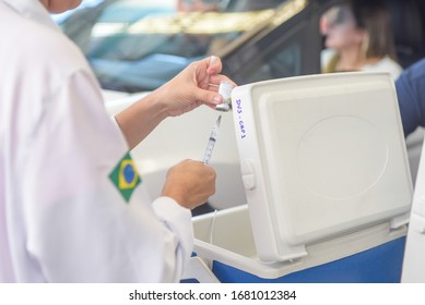 RIO DE JANEIRO, BRAZIL, MARCH, 23, 2020:flu Vaccination In Elderly People Using The Drive Thru System Receive The Vaccine Inside The Car To Prevent Crowding Due To The Coronavirus, Covid19