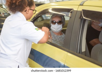 RIO DE JANEIRO, BRAZIL, MARCH, 23, 2020:flu Vaccination In Elderly People Using The Drive Thru System Receive The Vaccine Inside The Car To Prevent Crowding Due To The Coronavirus, Covid19