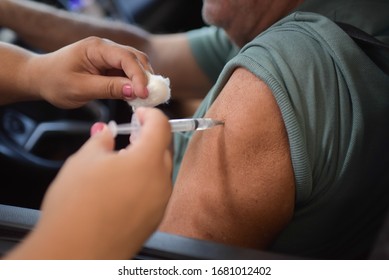 RIO DE JANEIRO, BRAZIL, MARCH, 23, 2020:flu Vaccination In Elderly People Using The Drive Thru System Receive The Vaccine Inside The Car To Prevent Crowding Due To The Coronavirus, Covid19