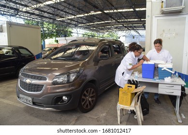 RIO DE JANEIRO, BRAZIL, MARCH, 23, 2020:flu Vaccination In Elderly People Using The Drive Thru System Receive The Vaccine Inside The Car To Prevent Crowding Due To The Coronavirus, Covid19