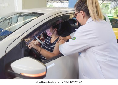 RIO DE JANEIRO, BRAZIL, MARCH, 23, 2020:flu Vaccination In Elderly People Using The Drive Thru System Receive The Vaccine Inside The Car To Prevent Crowding Due To The Coronavirus, Covid19