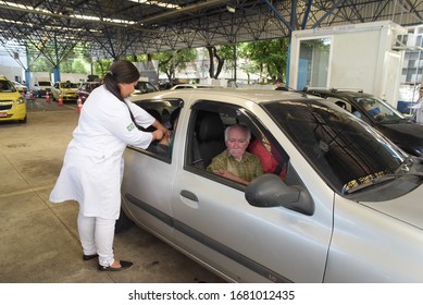 RIO DE JANEIRO, BRAZIL, MARCH, 23, 2020:flu Vaccination In Elderly People Using The Drive Thru System Receive The Vaccine Inside The Car To Prevent Crowding Due To The Coronavirus, Covid19