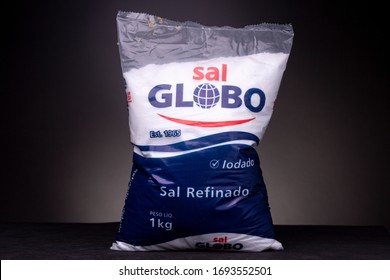 Rio De Janeiro, Brazil - March 23, 2020: Large 1 Kilo Plastic Pack Of Refined White Brazilian Kitchen Salt Of The Globo Brand Low Key Studio Still Life With Dark Grey Background