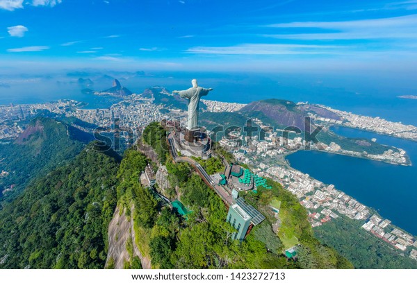 RIO DE JANEIRO, Brazil, May 20, 2019: Christ Redeemer and Corcovado Mountain, view from the bird's-eye view. Extremely beautiful Rio de Janeiro, Brazil . Panoramic aerial photography .