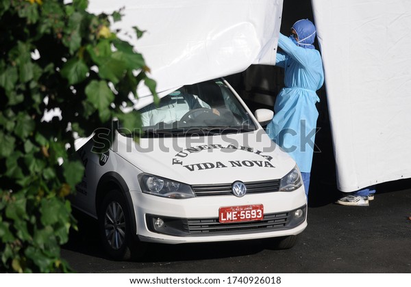 \
Rio de Janeiro, Brazil, May 25,\
2020.\
Funeral cars remove dead people by covid-19, at the Maracanã\
field hospital in the north of the city of Rio de\
Janeiro.