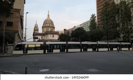 Rio De Janeiro City, Rio De Janeiro, Brazil - August 18th 2019: VLT (light Transport Vehicle) And Candelária Church In The Background.