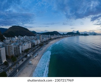 Rio de Janeiro City at Morning Twilight. Copacabana Beach and Atlantic Ocean. Blue Hour. Aerial View. Brazil.