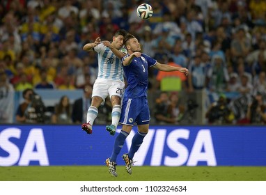 Rio de Janeiro, June 15, 2014. Football players compete for the ball during the Argentina vs Bosnia match for the 2014 World Cup, at the Maracanã stadium in the city of Rio de Janeiro