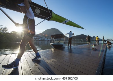 RIO DE JANEIRO - MARCH 14, 2016: Rower Carries A Shell Back To The Clubhouse At Lagoa Rodrigo De Freitas Lagoon, A Venue For The Rio 2016 Olympic Games.