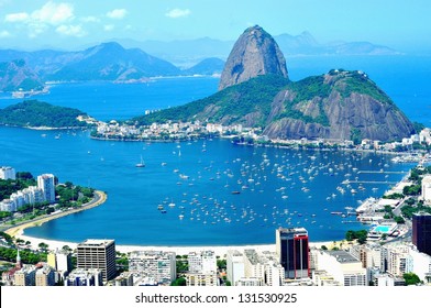 Rio De Janeiro, Olympic City 2016 - Sugar-loaf. Suffering With COVID19 And Corruption Scandals. Tourist Site In The Former Capital Of Brazil.  Water Around, And Niteroi City In The Background.