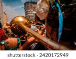 Rio de Janeiro, RJ, Brazil. February, 07, 2016. A musician playing trombone in a street parade at carnival of Rio de Janeiro.