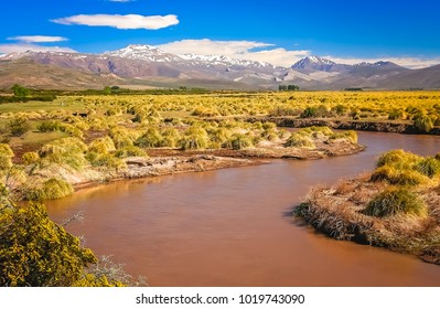 Rio Grande River Flowing Through Wide Valley In Northern Argentina, South America