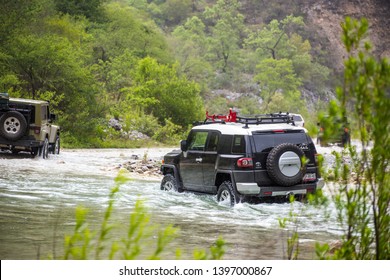 Rio Pilon, Nuevo Leon, Mexico. May 12, 2019.  Toyota land cruiser crossing a river. Rio Pilon. Mexico.