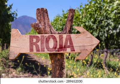 Rioja Wooden Sign With Vineyard Background